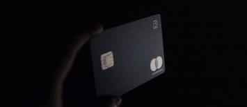 Black corporate business card on a black background