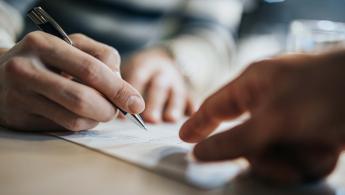 Man signing contract
