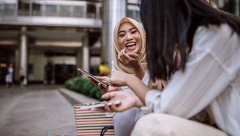 Women laughing sitting down