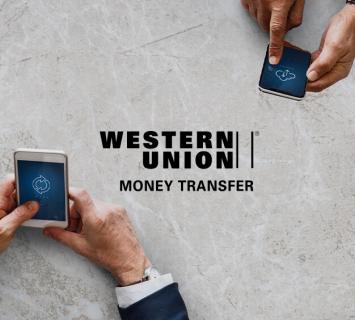 Two men using online banking western union transfers