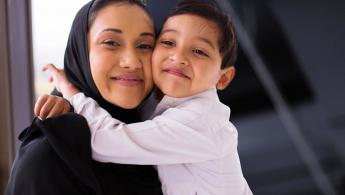 Mother and her young son smiling