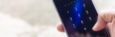 person using mobile phone up close